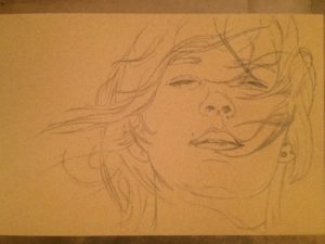 Sketch of a face on sennlier pastel card